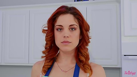 Solo looking good in apron kitchen cooking self play from white redhead Molly Stewart mid 20s contented lady
